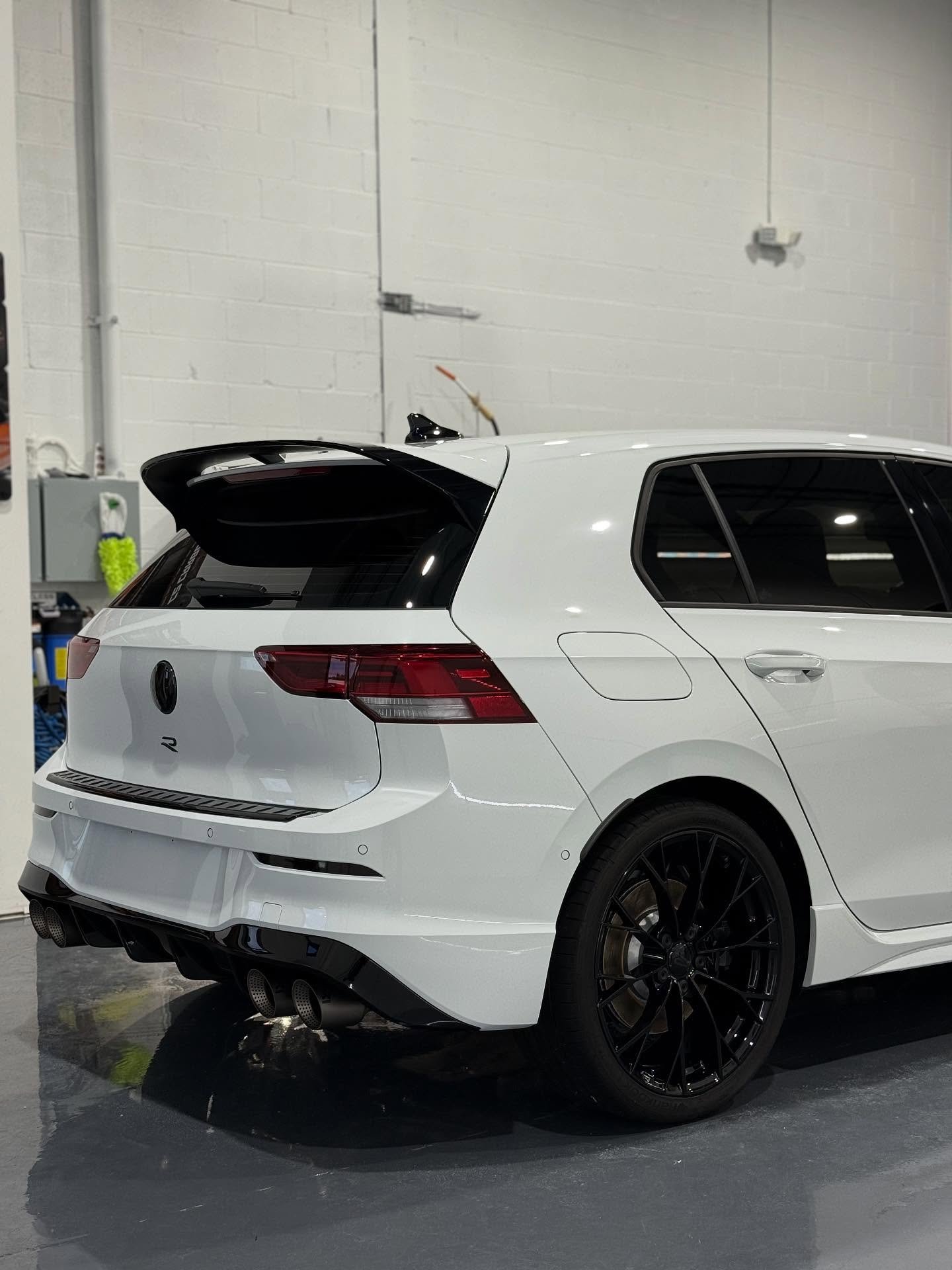 White Volkswagen Golf R with vehicle window tinting in Fraser